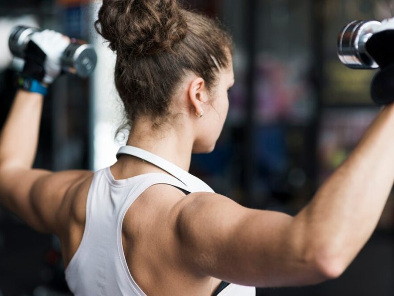 anonymous-woman-exercising-with-dumbbell_23-2147789671