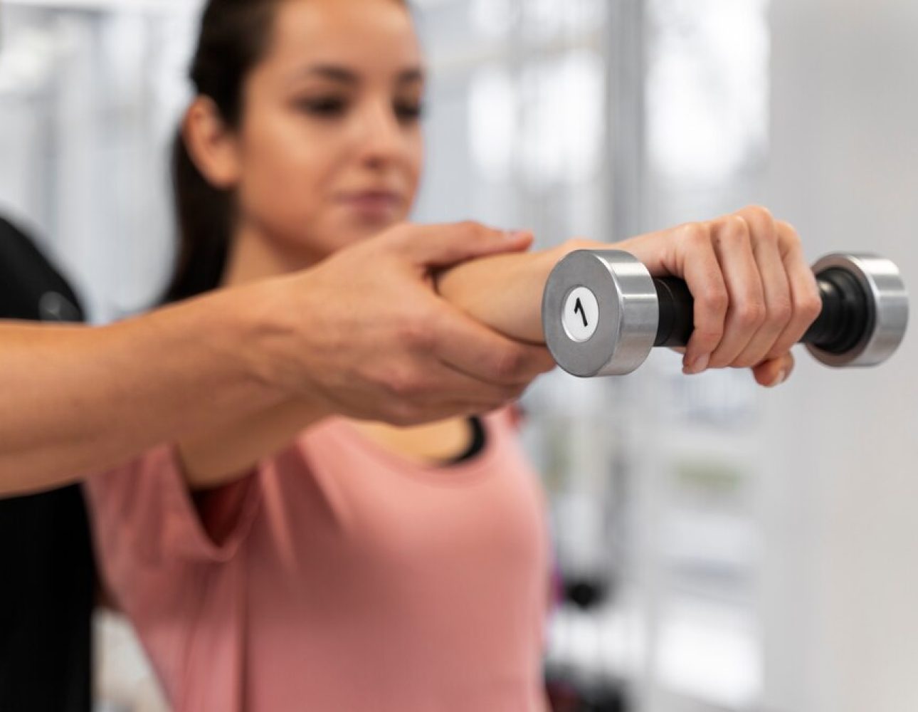blurry-woman-exercising-with-dumbbell-close-up_23-2149178071